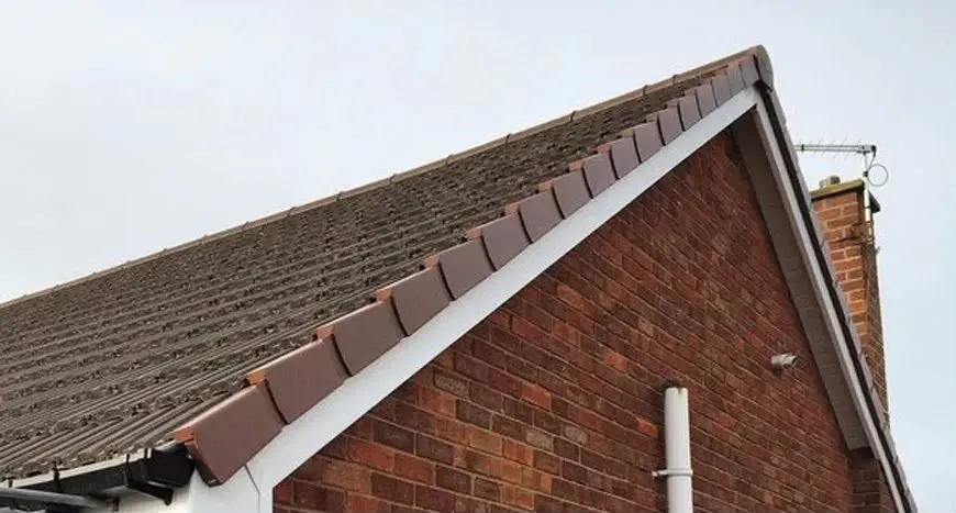Dry verge units running down the gable end of a tiled roof